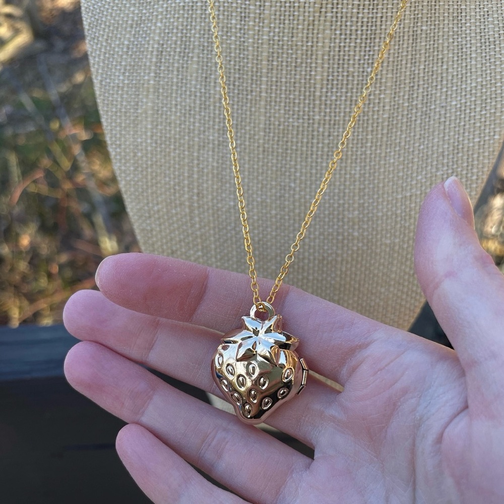 Gold strawberry locket necklace